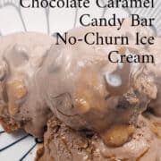 Decadent no-churn peanut chocolate caramel ice cream with candy bar chunks in a stylish bowl.