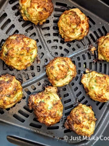 air fried meatballs in the air fryer basket evenly spread out 3 by 3