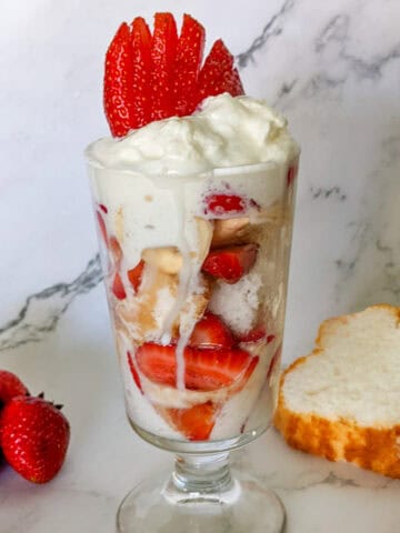 Strawberries, Banana, Angle Food Cake and Whipped Cream Layered in a Glass Cup