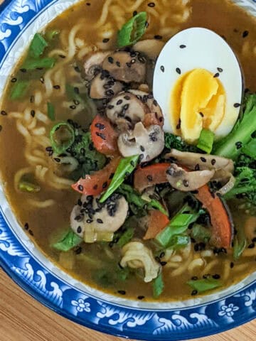 instant ramen noodles with sliced vegetable and an egg