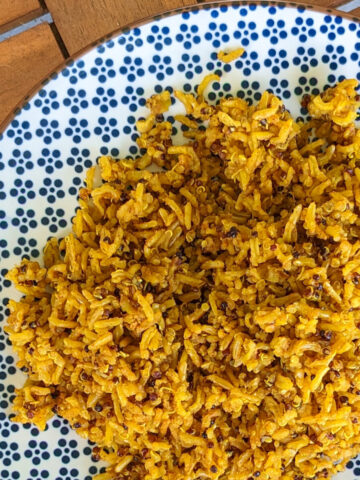 Spiced brown basmati rice in a decorative blue and white plate