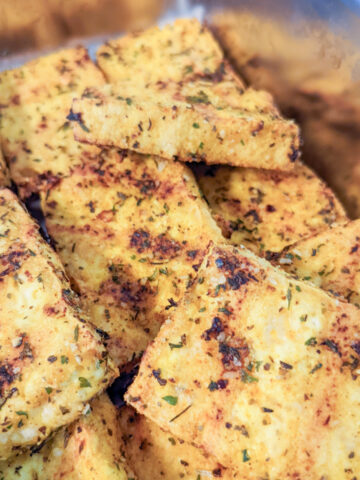 air fried tofu with dried herbs in a metal container