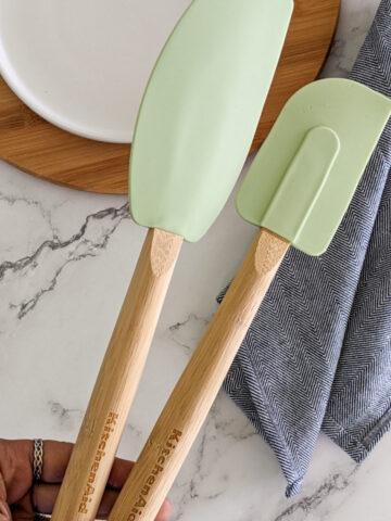 two KitchenAid silicone spatulas held in the hand