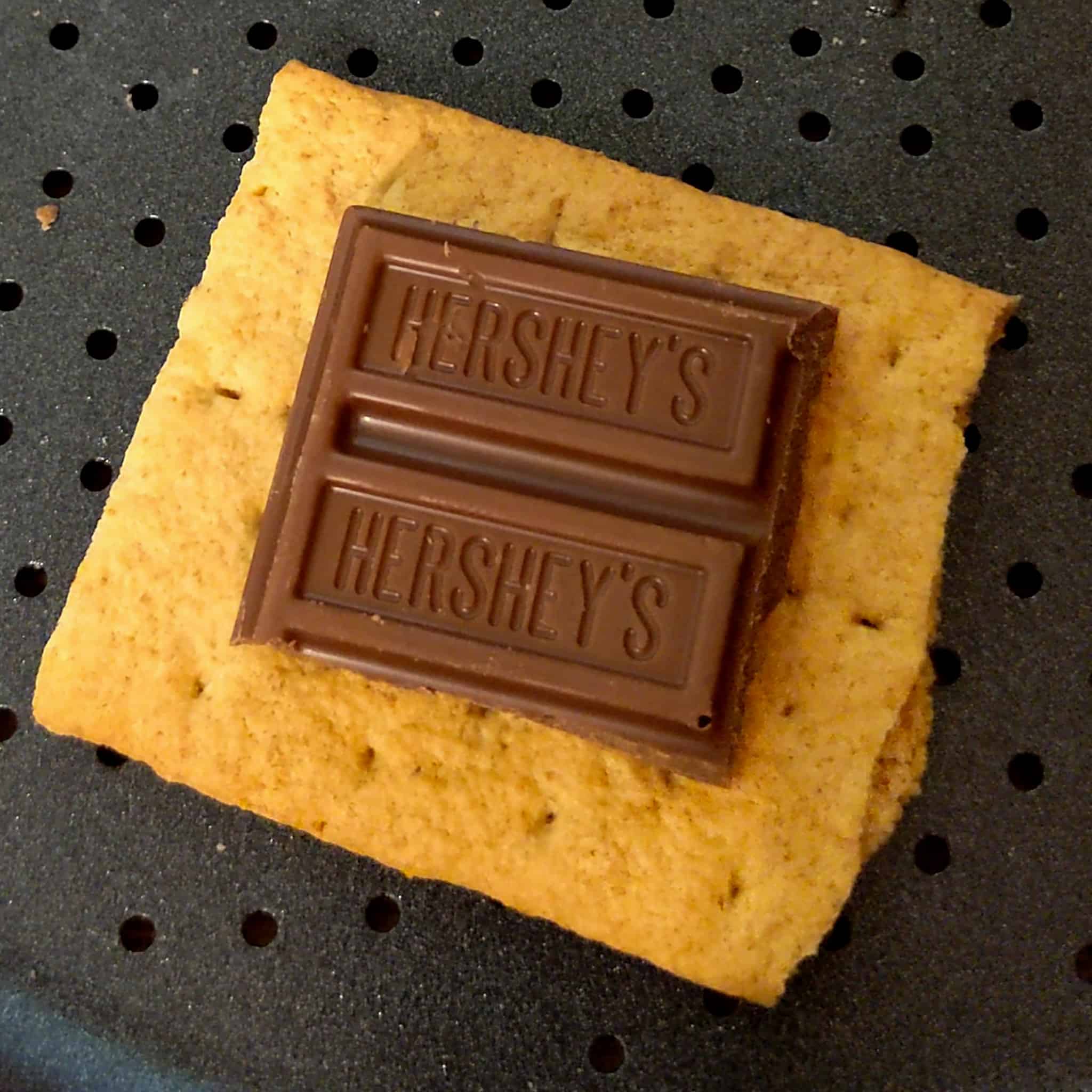 honey maid graham cracker with Hershey's milk chocolate for the air fryer s'mores cookies recipe on an air fryer tray