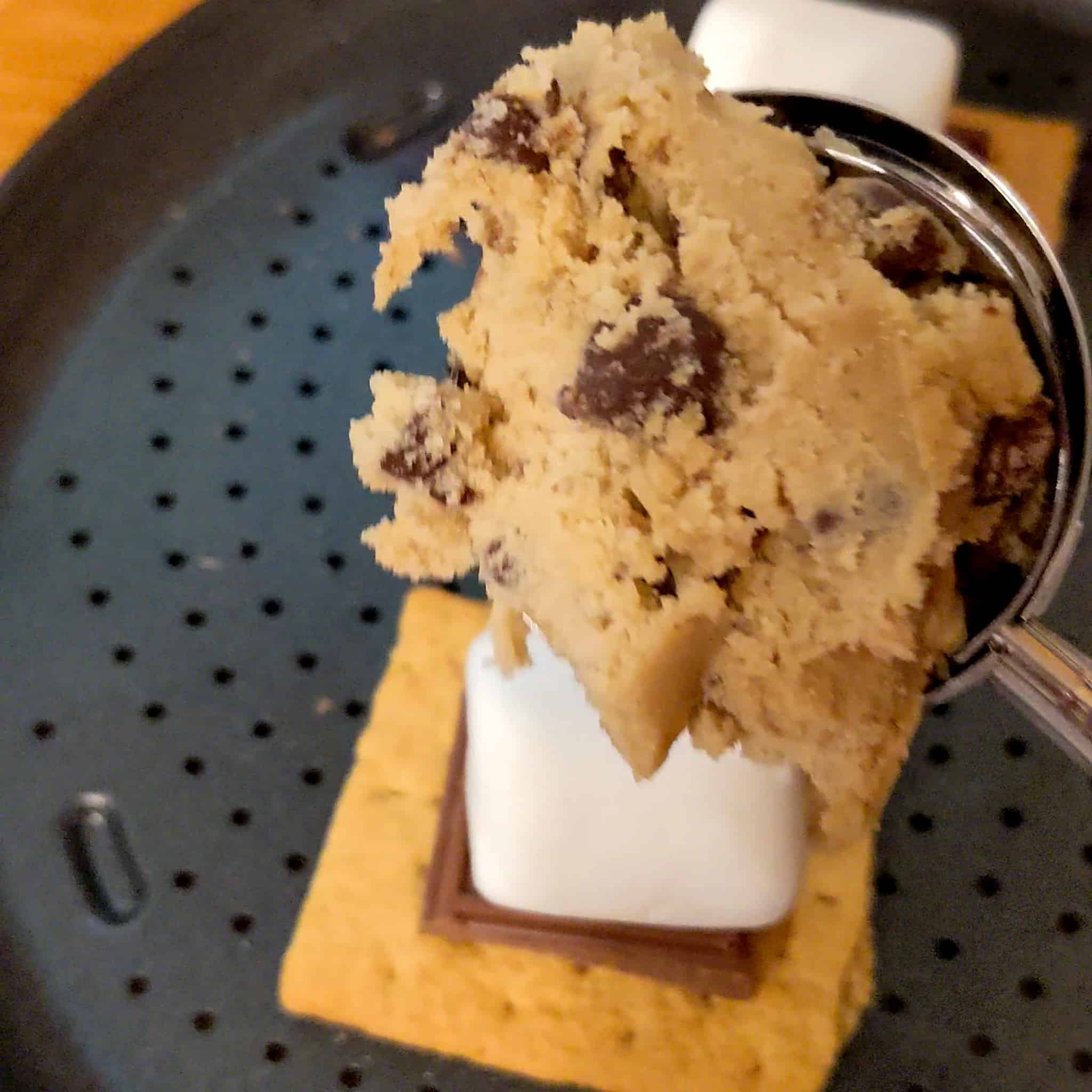 toll house chocolate chip cookie dough scooped in a cookie scooper