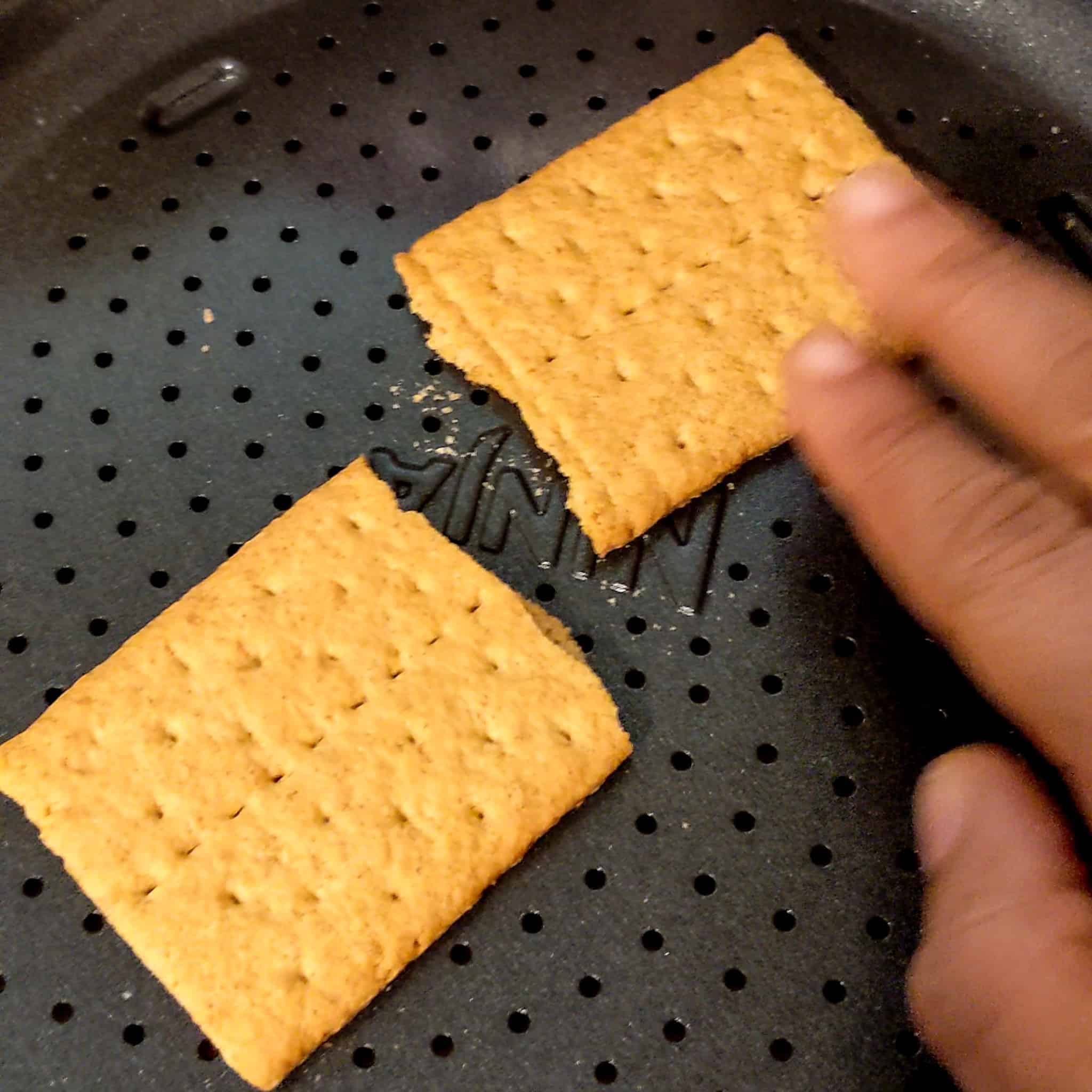 a sheet of graham cracker split in half for the air fryer s'mores cookies recipe