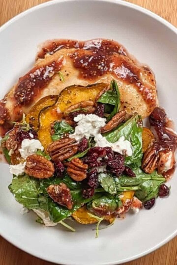 top view of the Chicken Paillard with Cranberry Pecan Acorn Squash Salad, a dish perfect for fall.