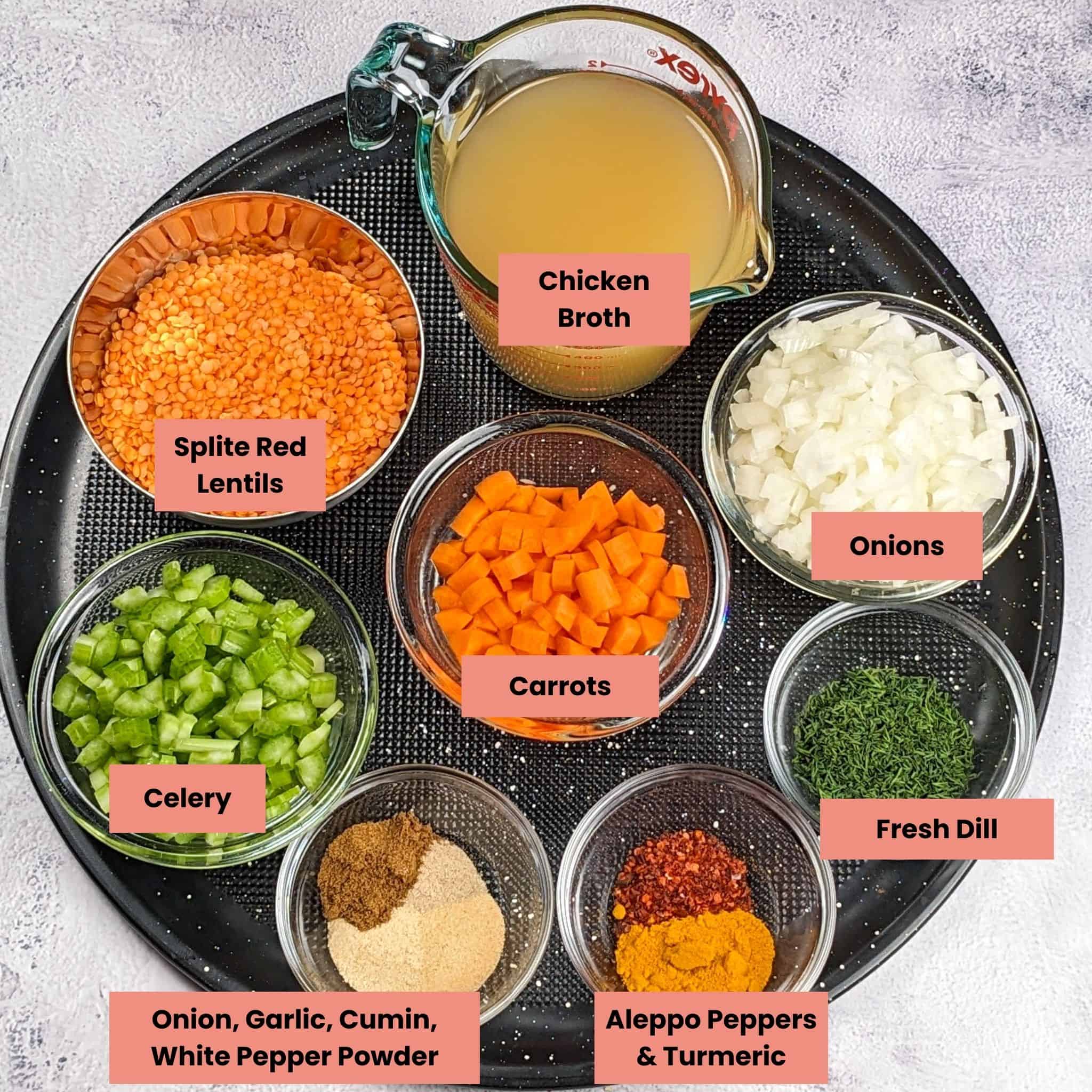 dill lentil chicken soup ingredients in containers labeled in a large round pizza pan