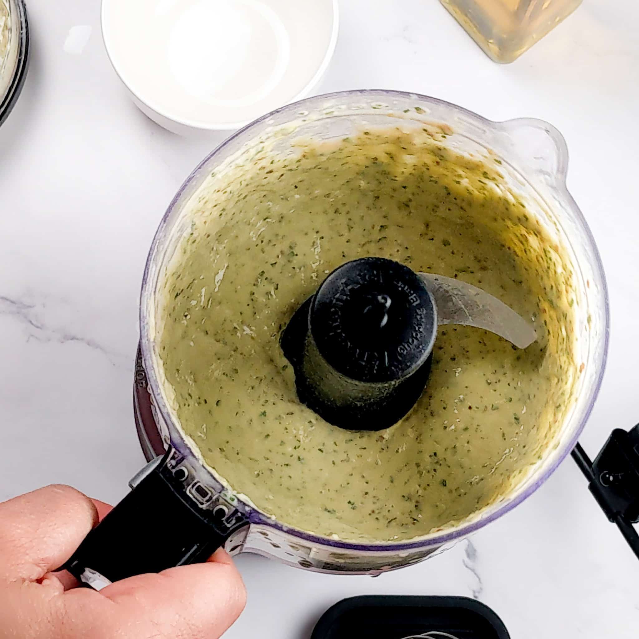 Tahini dressing in a food processor container