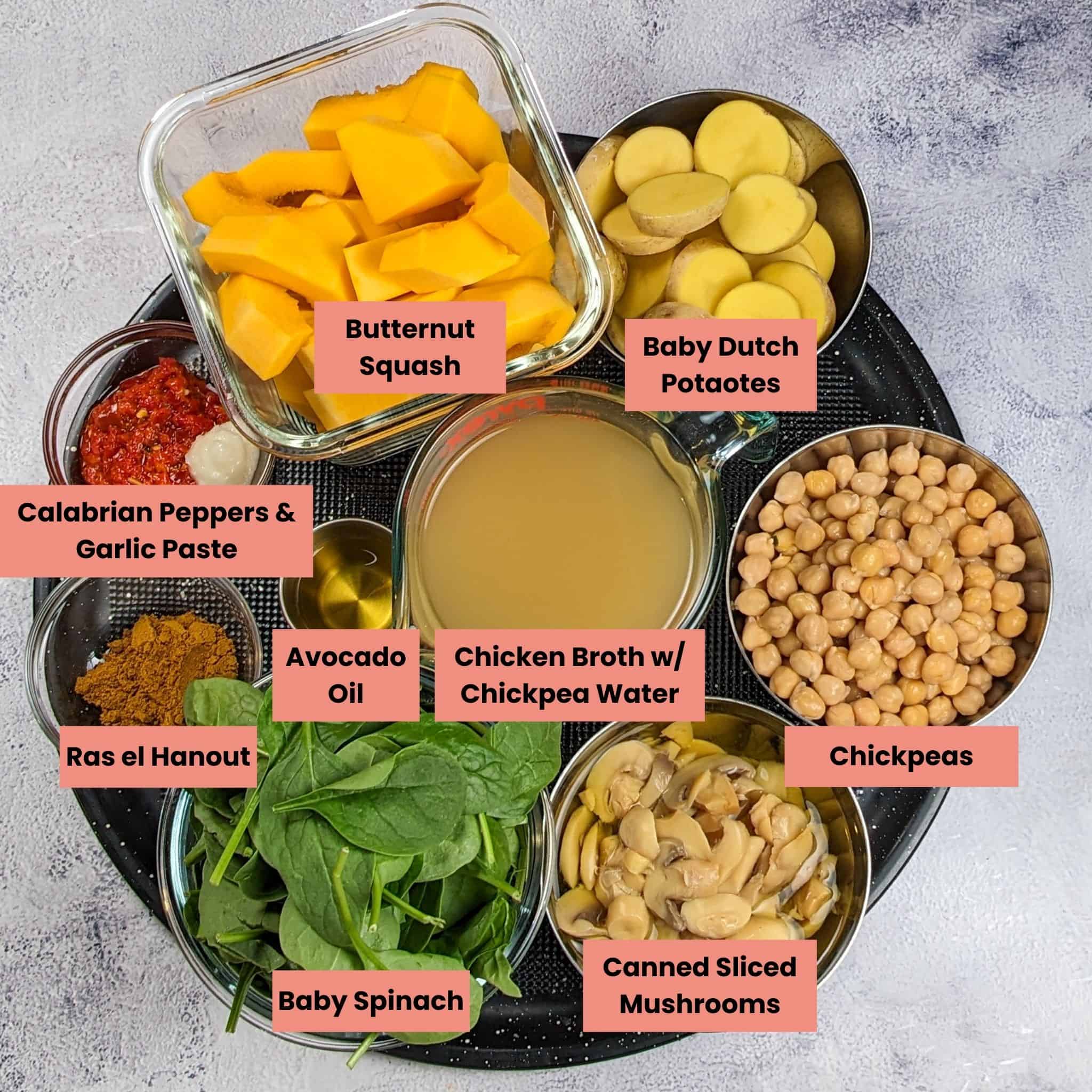 Air Fryer Butternut Squash Spiced Chickpeas Chicken Soup ingredients in containers in a large round pizza pan