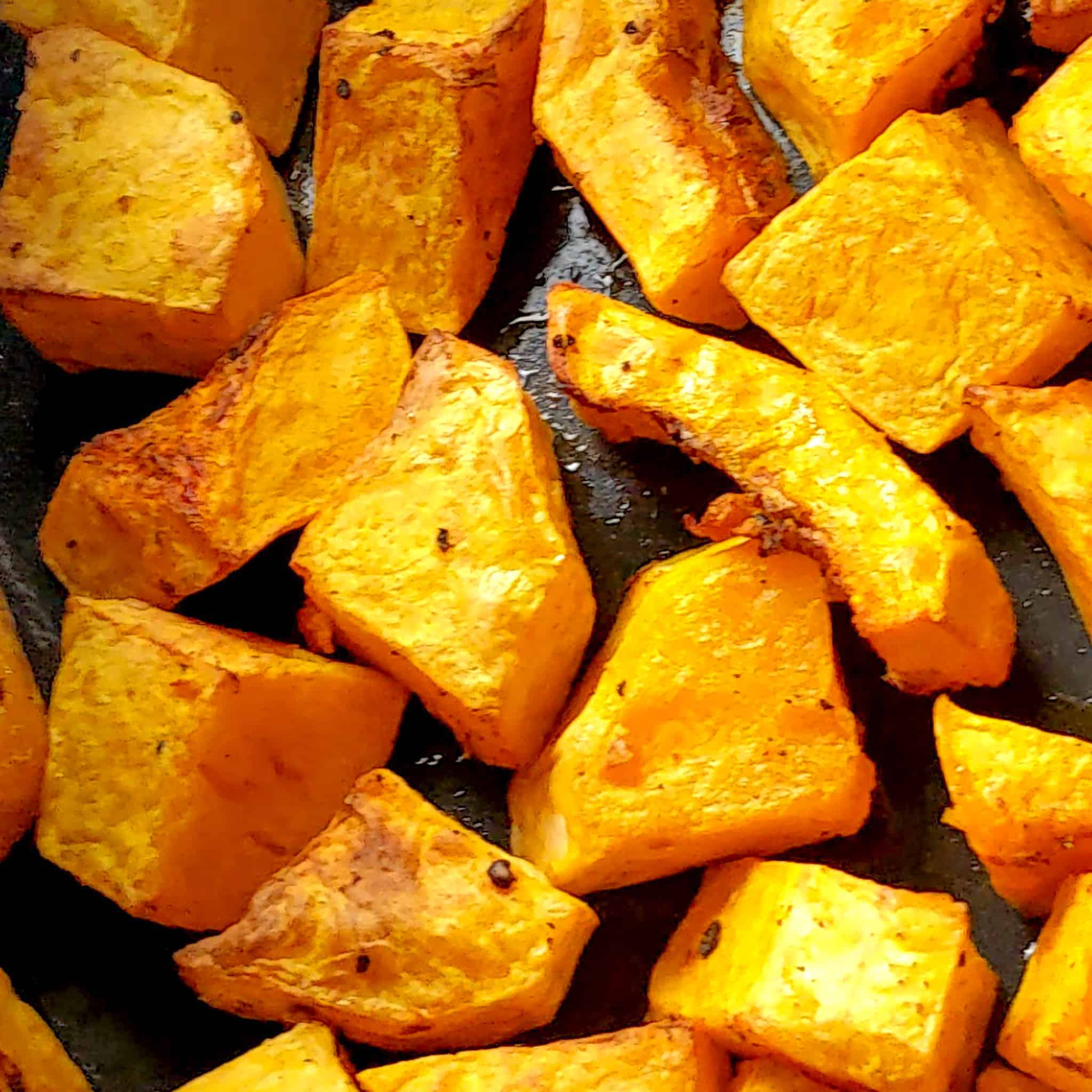 roasted air fried thick sliced peeled butternut squash in an air fryer roasting pan attachment