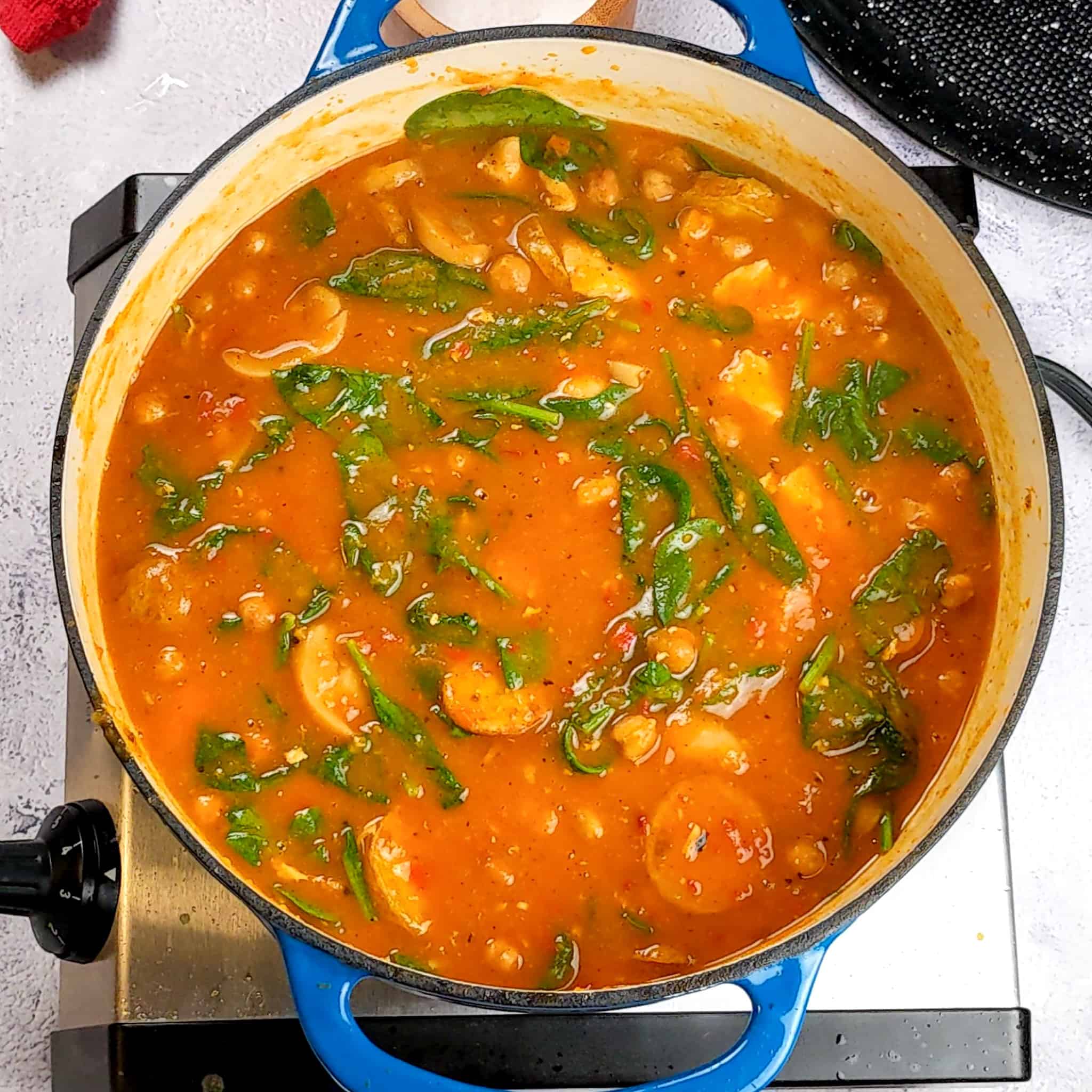 the Butternut Squash Spiced Chickpeas Chicken Soup top view in a Dutch oven