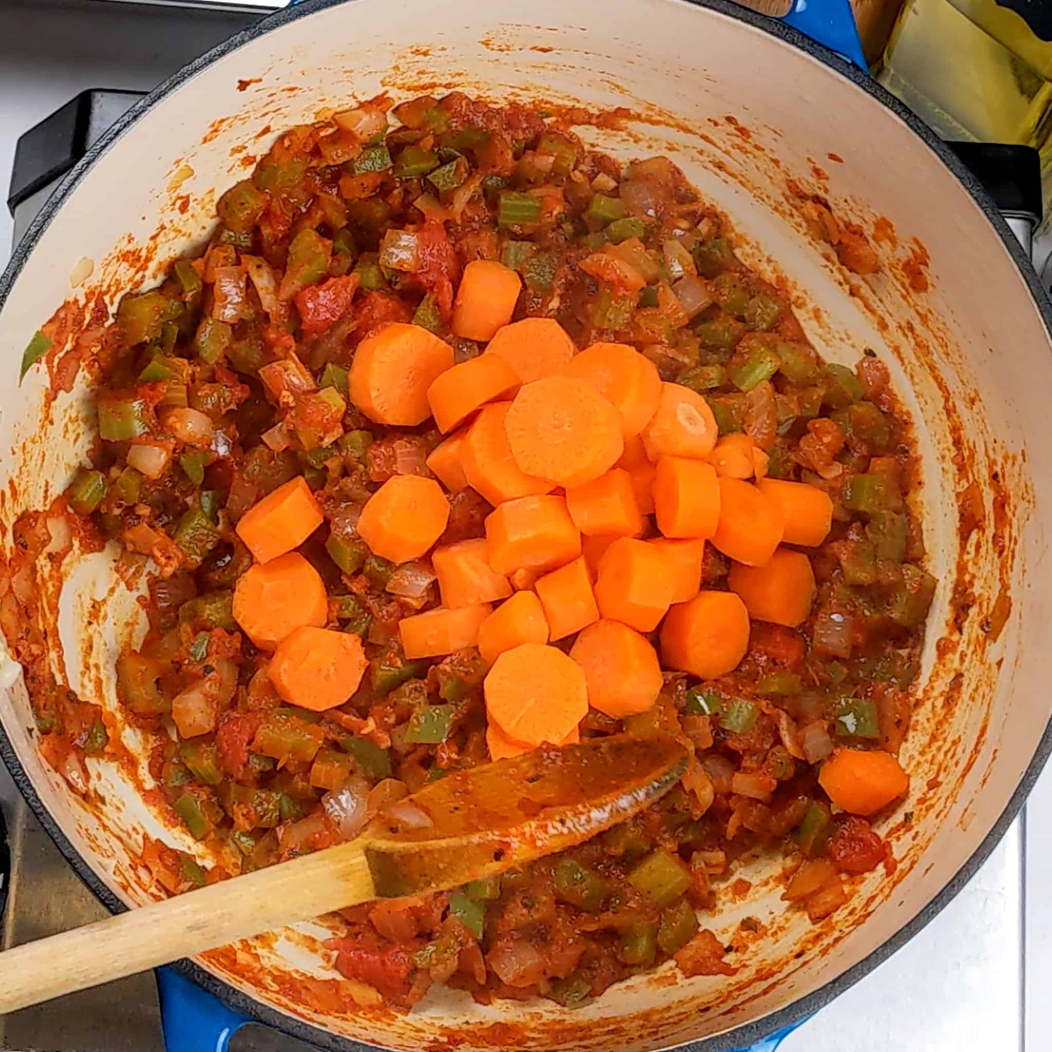 tomato sauced cooked down with diced onions, bell pepper, celery and garlic with raw thick sliced carrots on top.