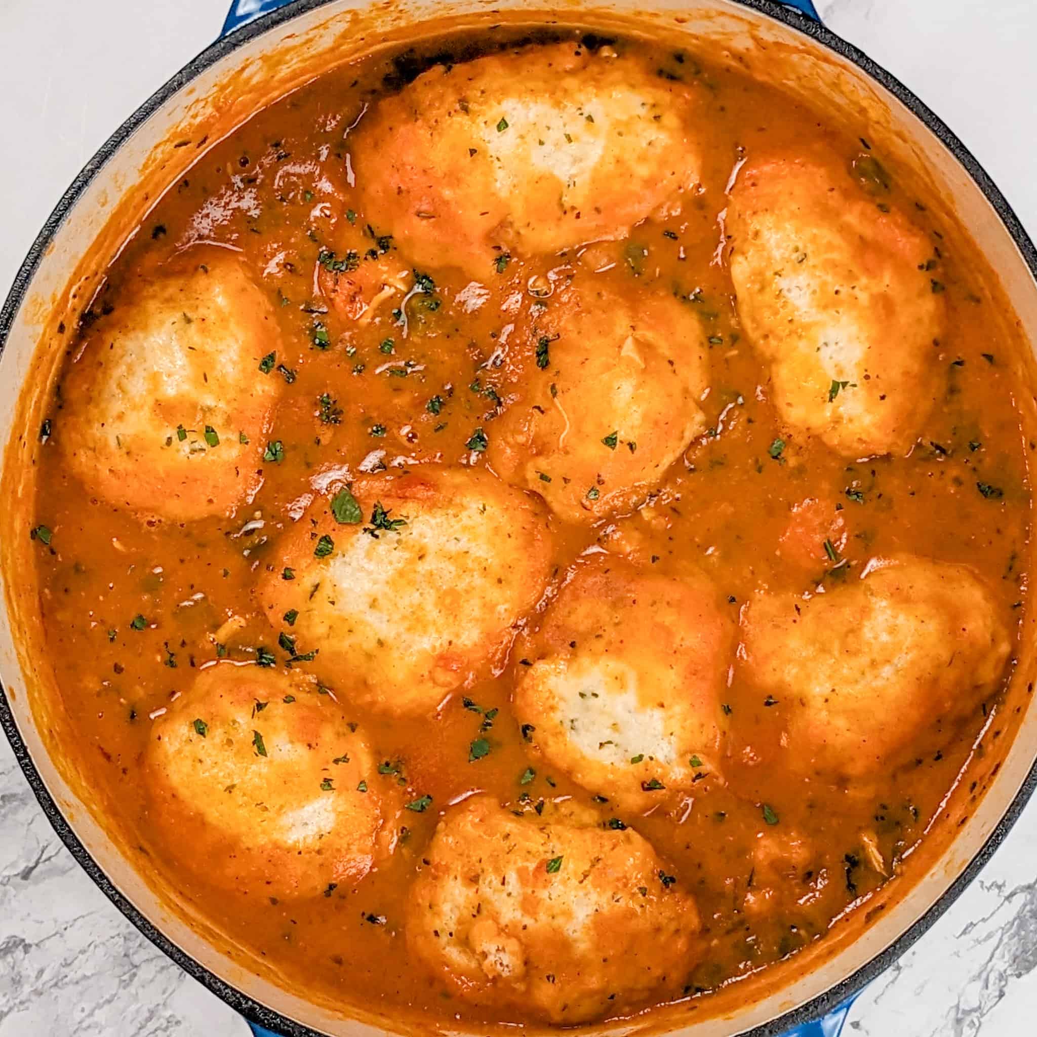 top view of the sweet potato chicken dumplings in a dutch oven