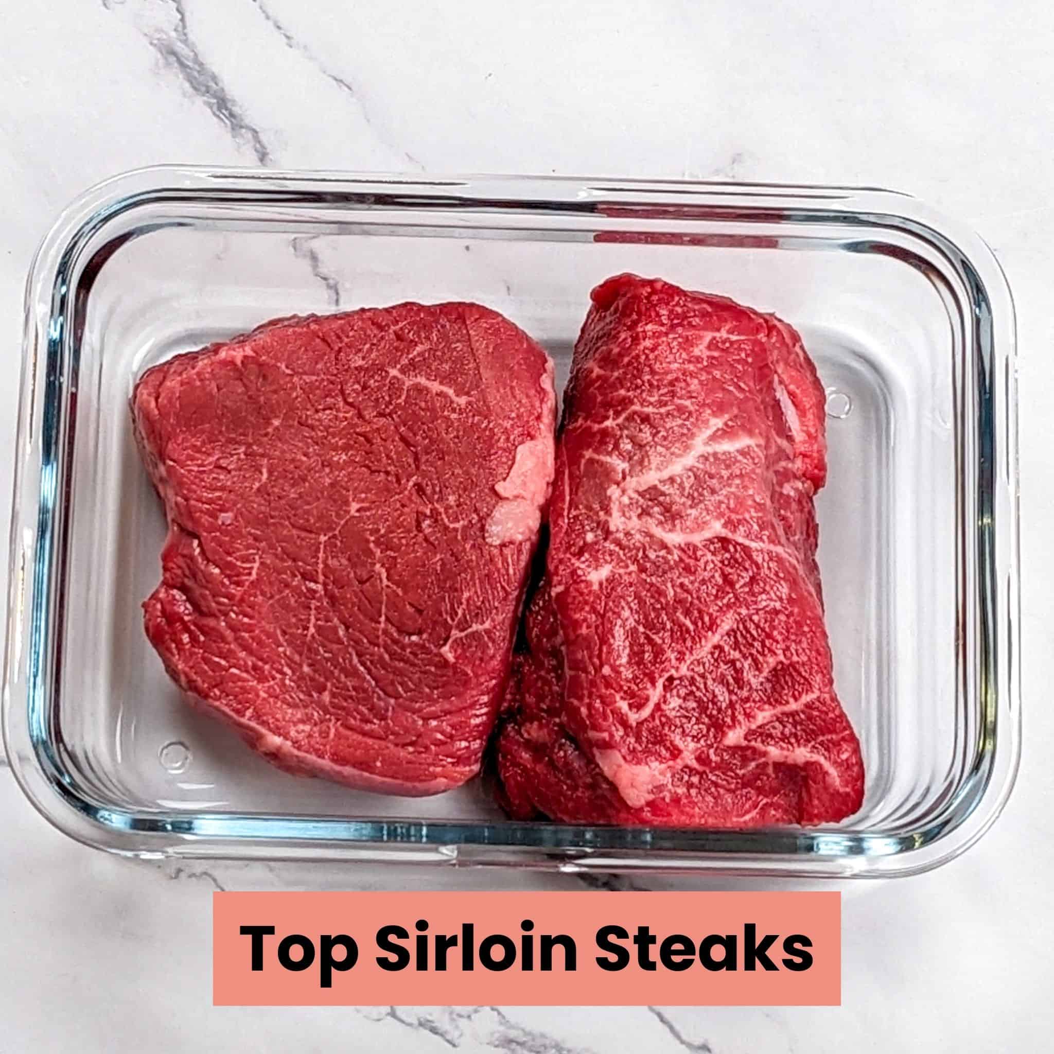 top sirloin steaks in a rectangle glass container