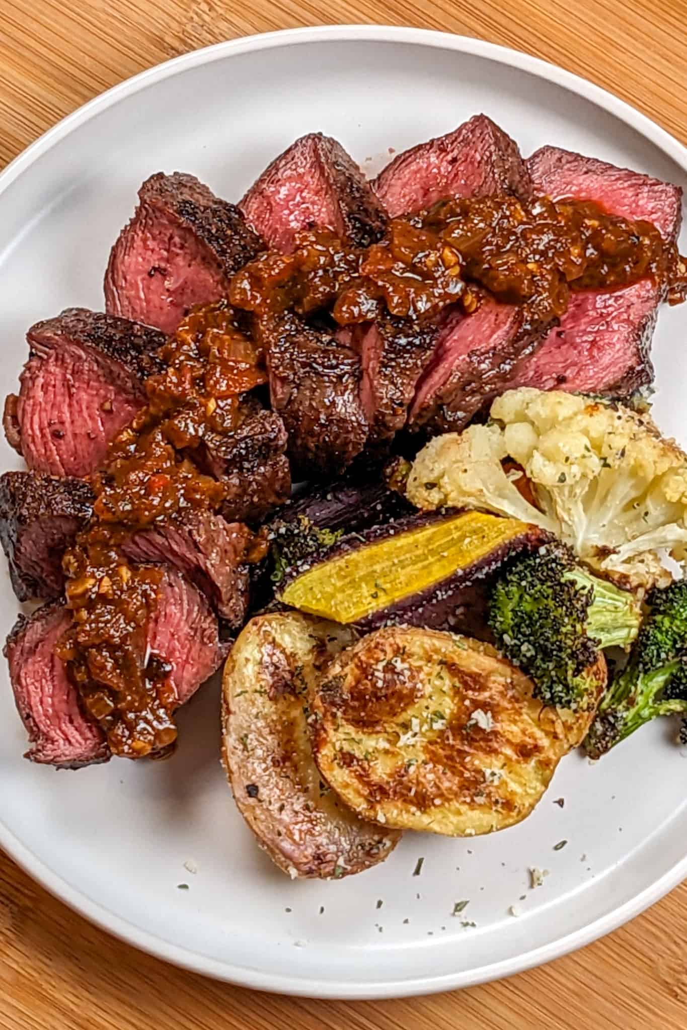 top view of the Pan-Seared Sirloin Steak with Spicy Baharat Sauce dish