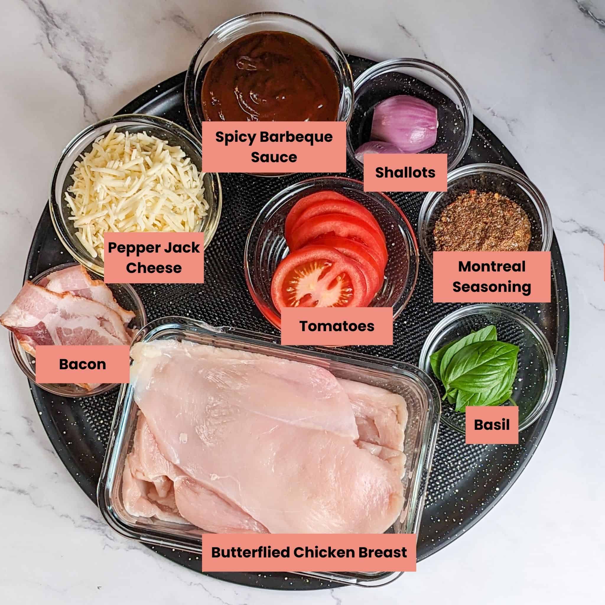 Ingredients for the Easy Baked Cheesy Crispy Barbeque Chicken Cutlets in containers on a round large pizza pan.