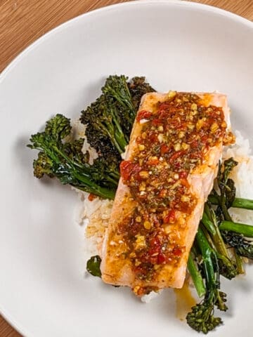 top view of the Calabrian Pepper Basil Baked Salmon and Broccolini in a wide round pasta bowl
