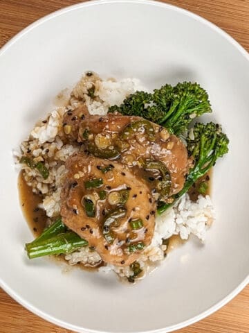 top view of the Spicy Honey Jalapeno Lime Chicken with Broccolini om a wide round bowl.