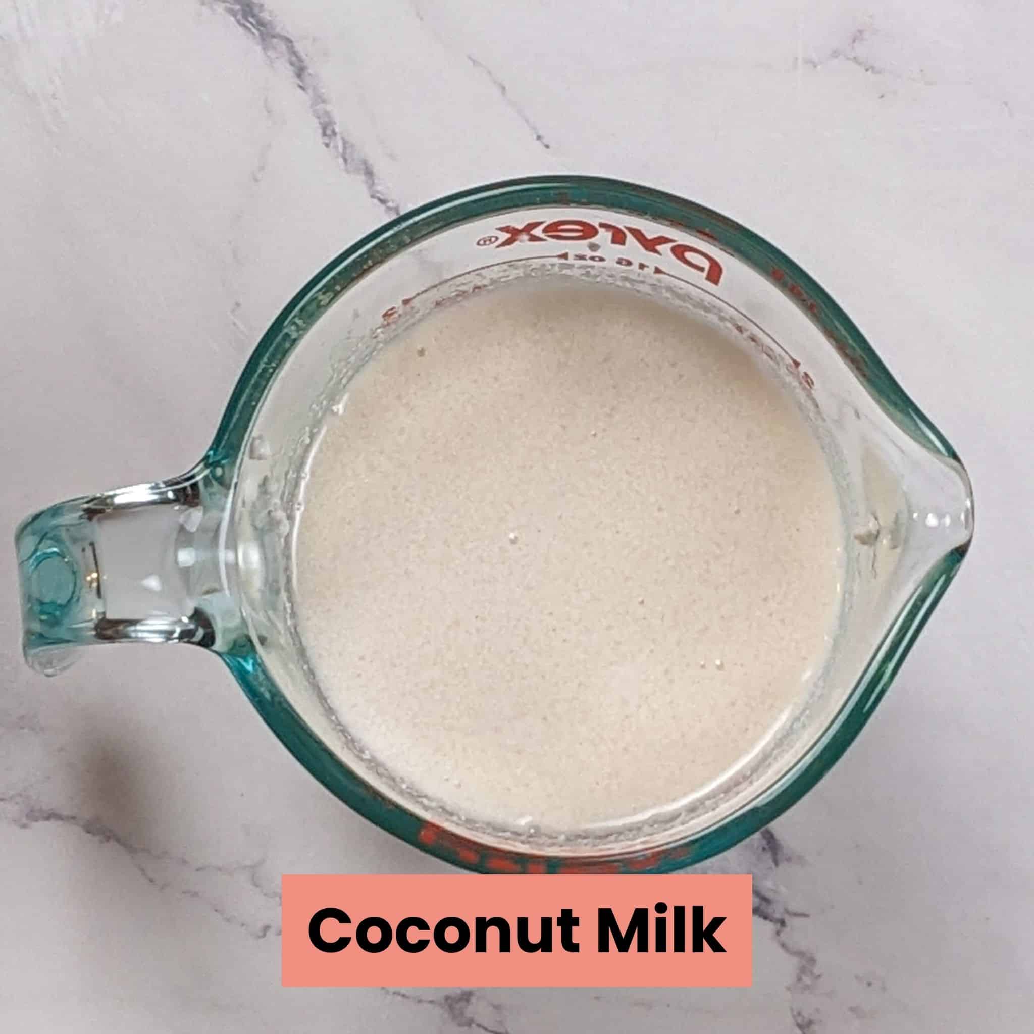 coconut milk in a pyrex measuring cup