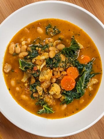 top view of the Vegetarian Ras El Hanout White Bean and Kale Soup dish