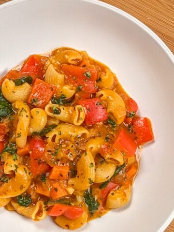 top view of the Macaroni Cheese Tomato Stew in a wide round deep bowl