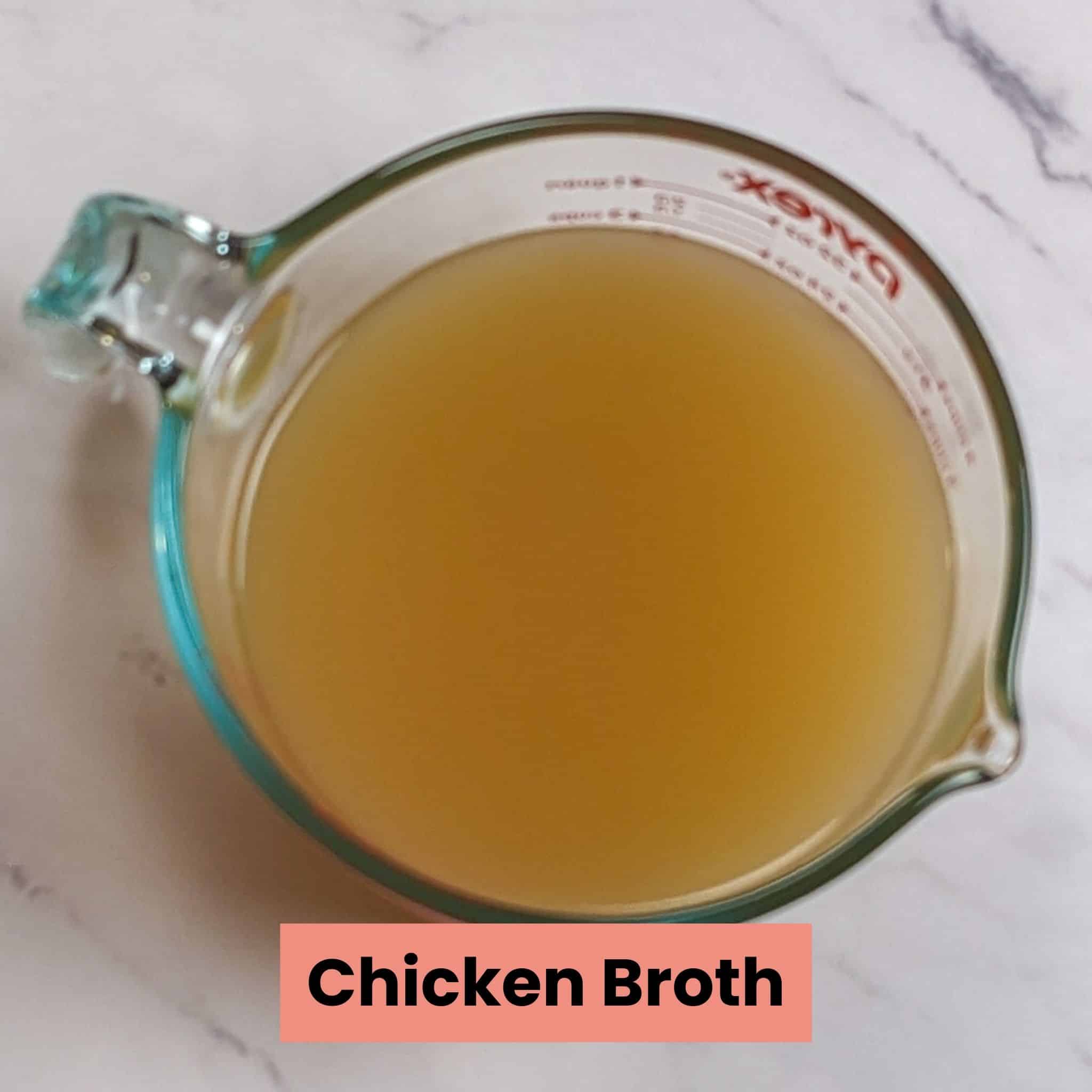 chicken broth in pyrex glass measuring cup