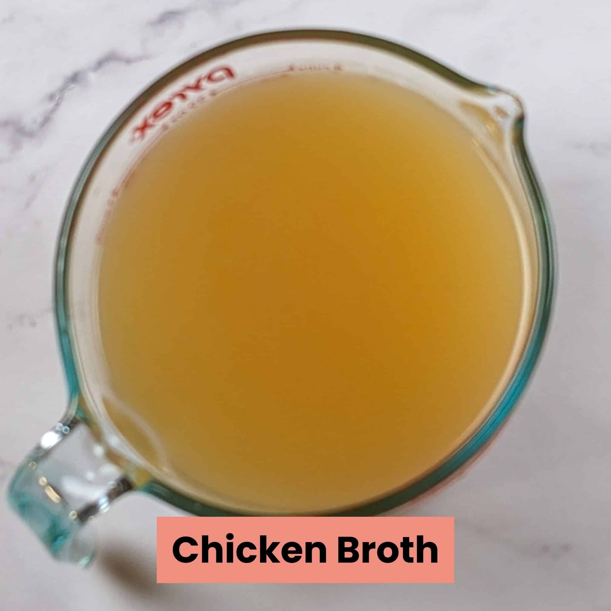 low-sodium chicken broth in a pyrex glass measuring cup