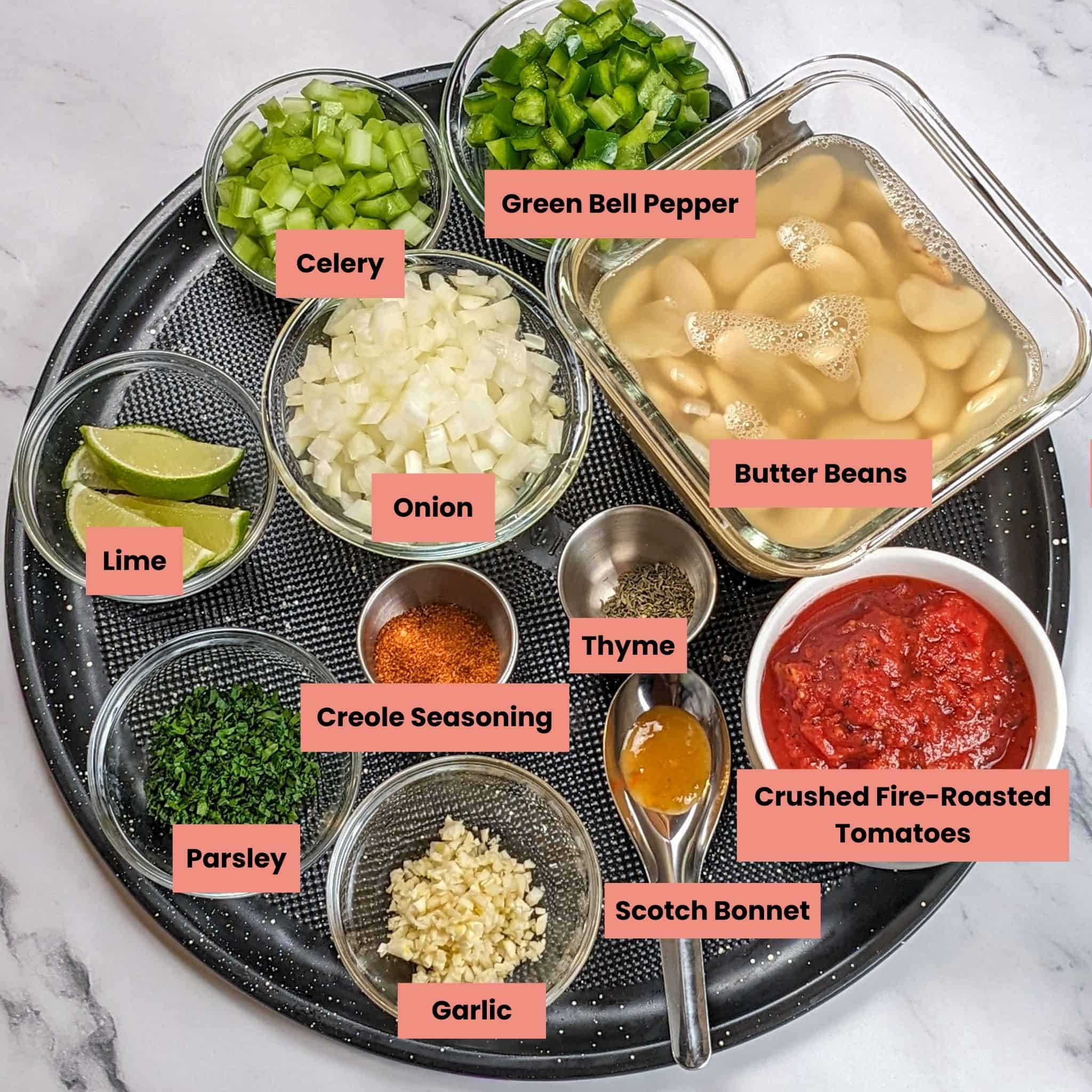 ingredients for the Pan-Seared Cajun Spiced Tilapia on White Bean Stew recipe in glass containers on a large round pizza pan