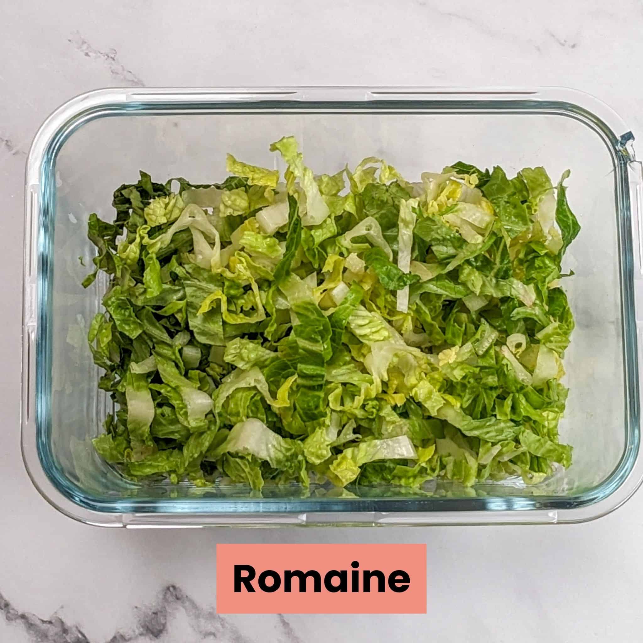 shredded romaine in a deep glass rectangle container