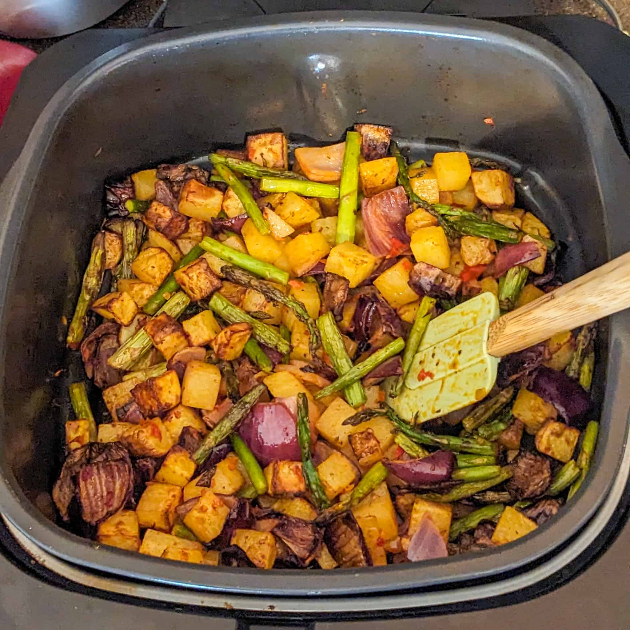 top view of the roasted vegetables in a ninja foodi 5-in-1 air fryer roasting pan