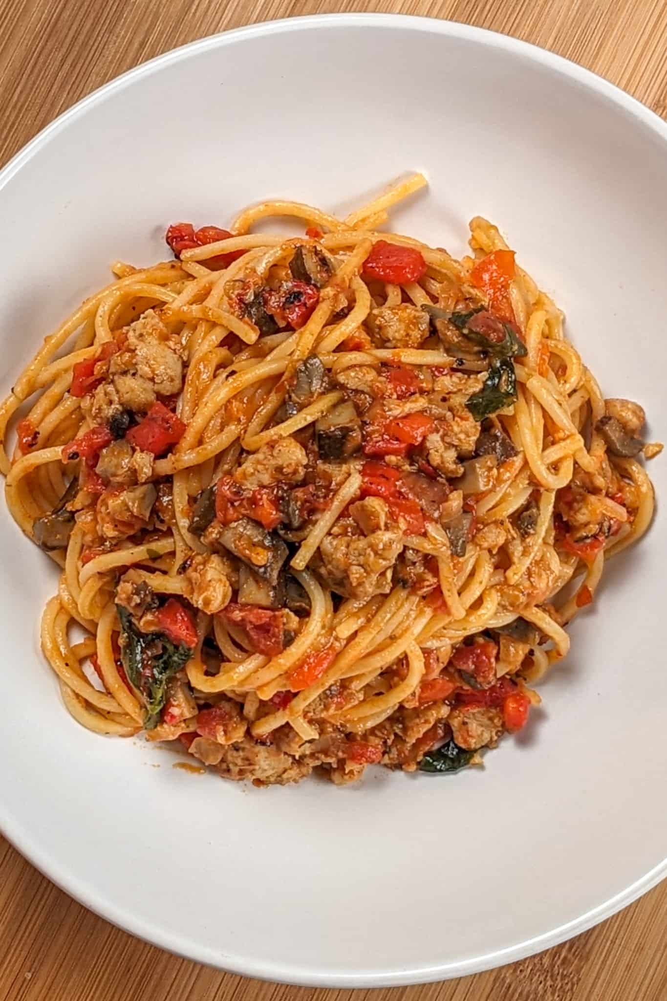 top view of the Easy Spicy Calabrian Italian Chicken Sausage Bolognese om a wide rim bowl