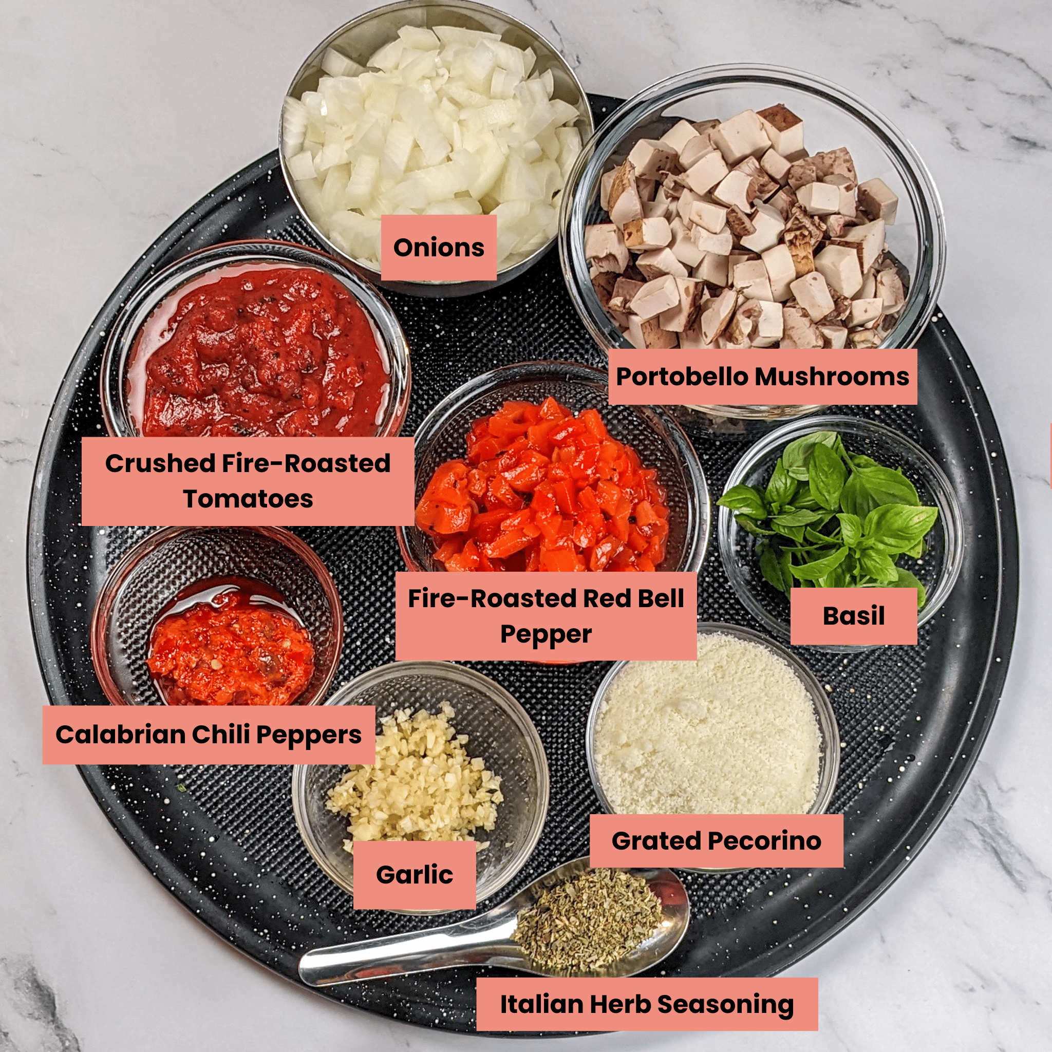 ingredients for the Easy Spicy Calabrian Italian Chicken Sausage Bolognese recipe in containers on a large round pizza pan
