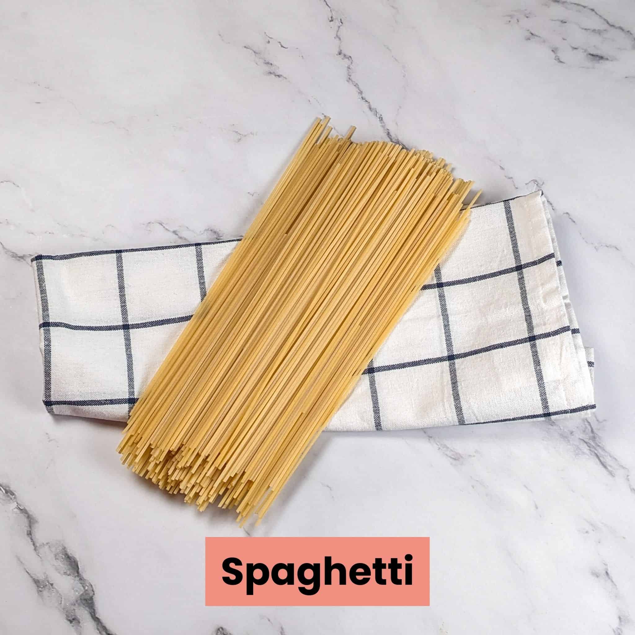 a pile of dry spaghetti on a kitchen towl
