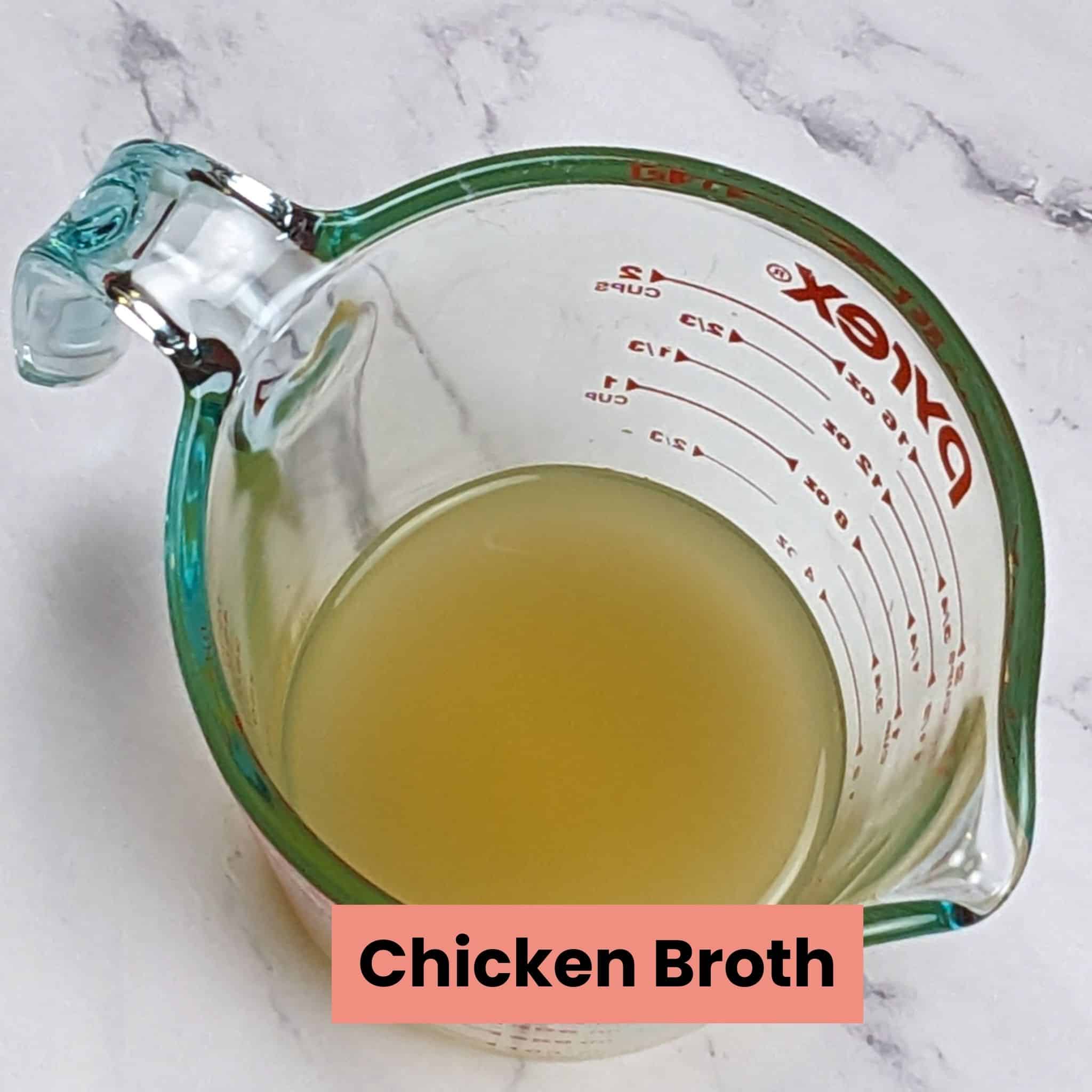 low sodium chicken broth in a pyrex 2-cup measuring cup