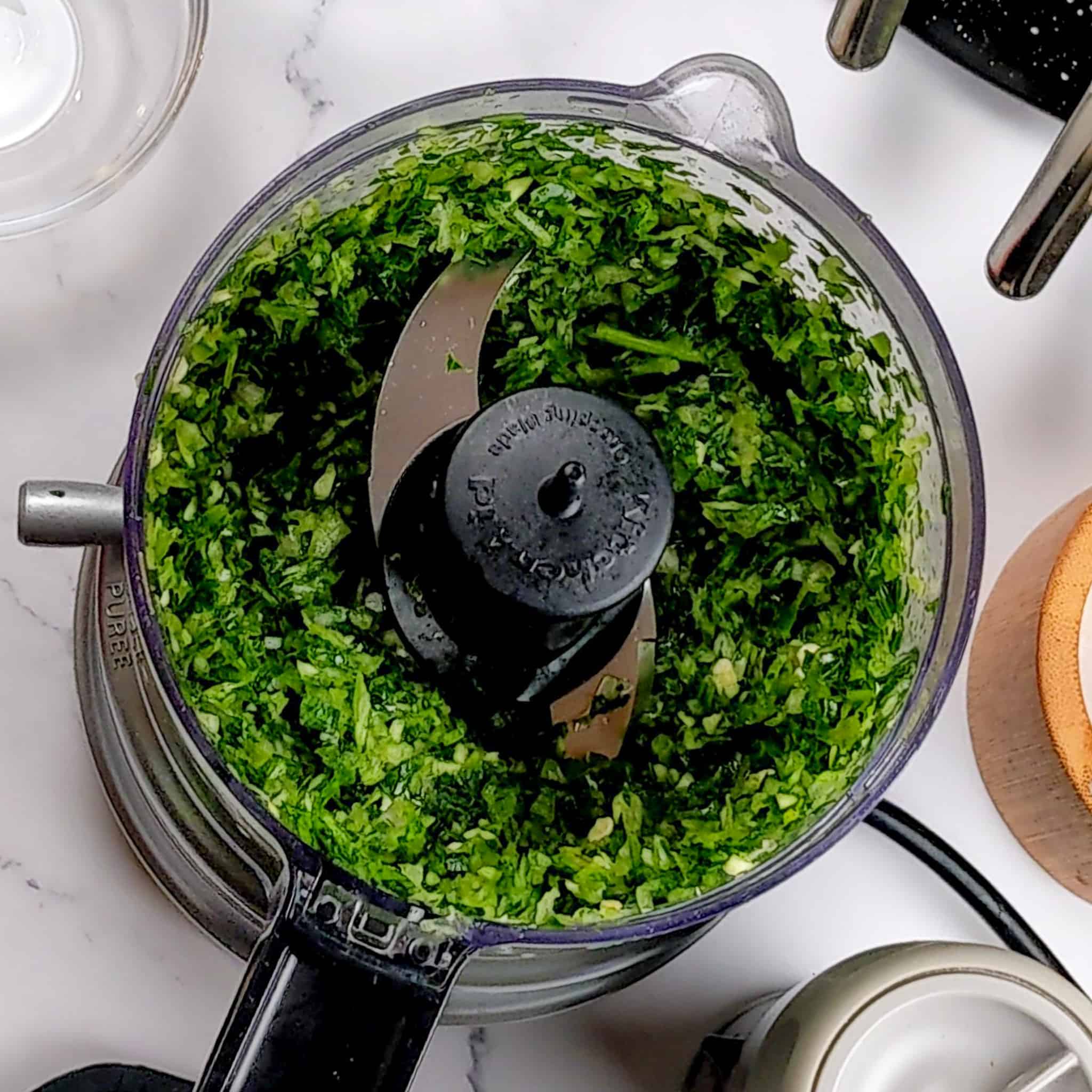 chopped herbs in a food processor.