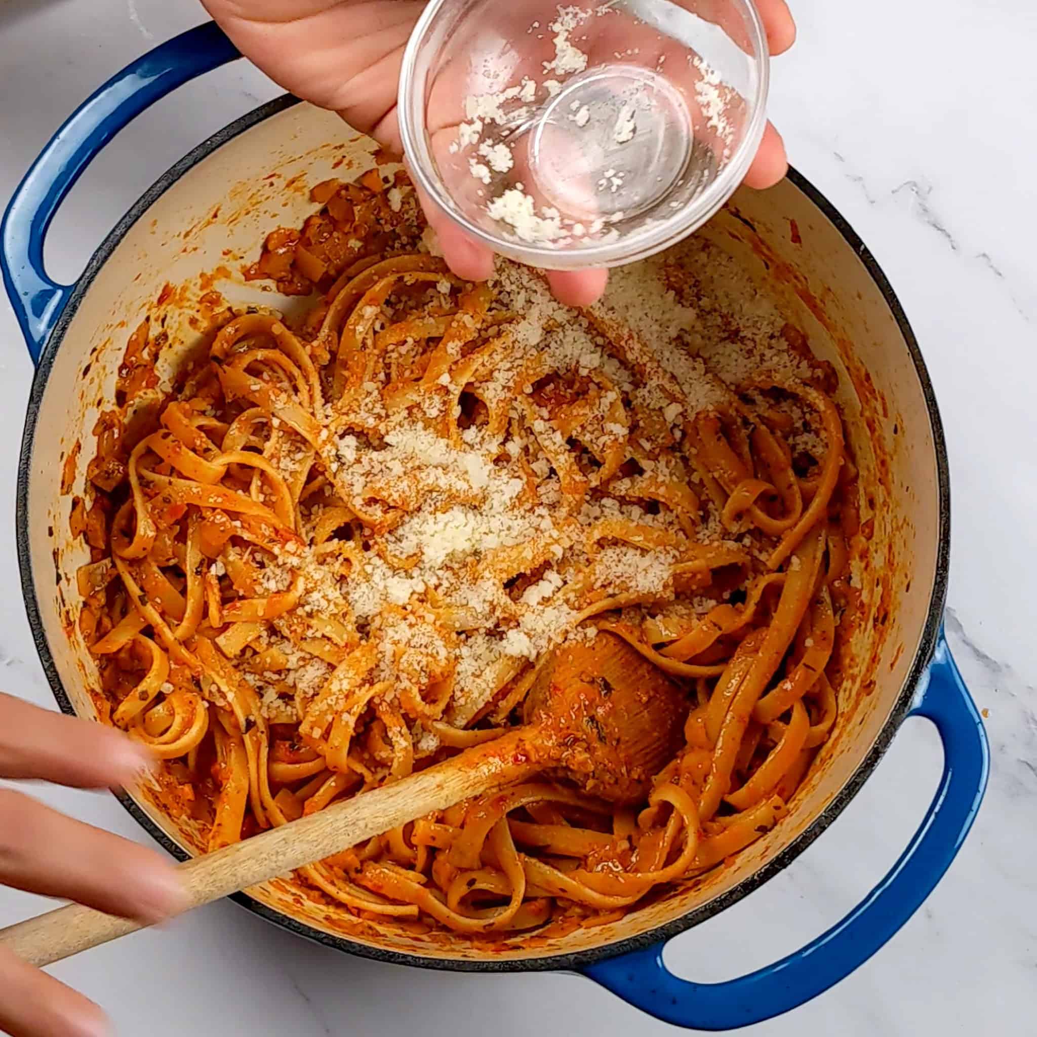 grated italian cheese blend added to the chicken and fettuccini garlic chili sauce pasta.