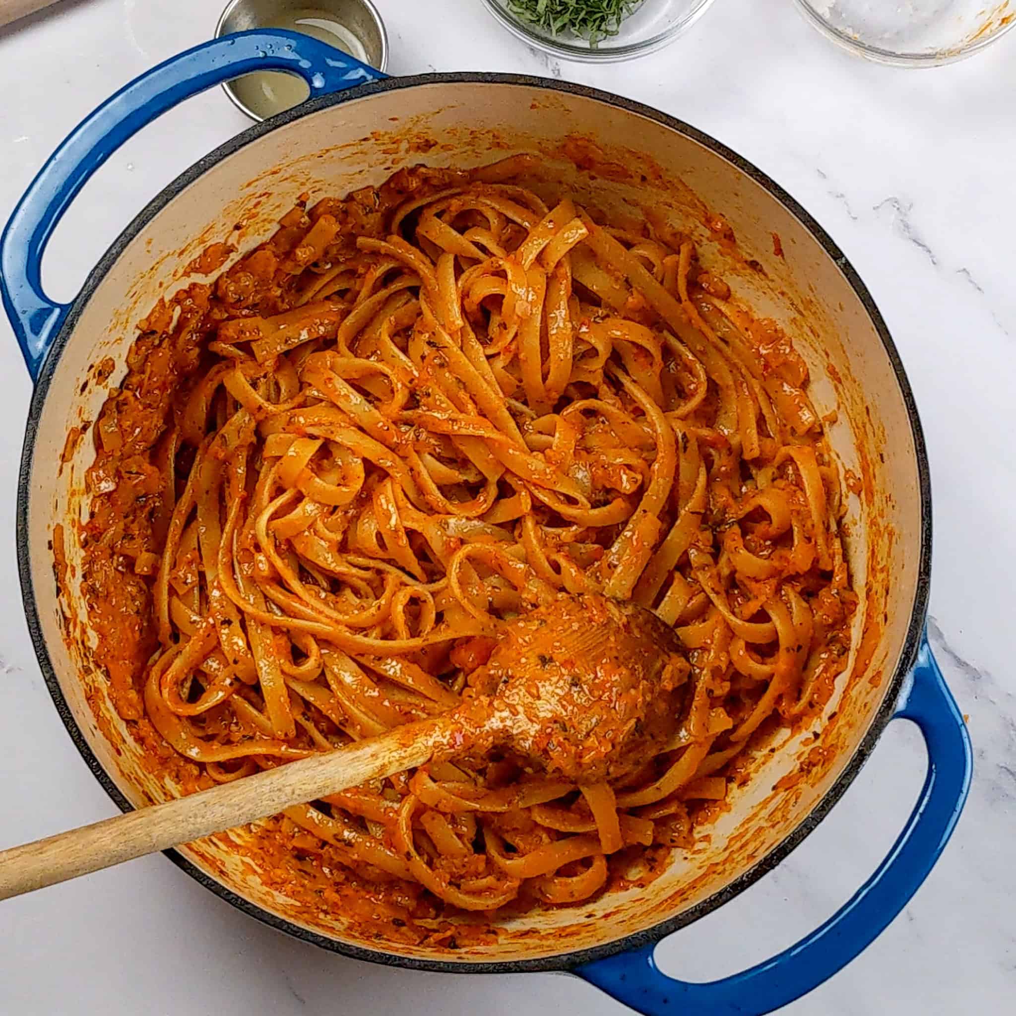 chili garlic sauce pasta sauce soaked fettuccini pasta in a dutch oven.