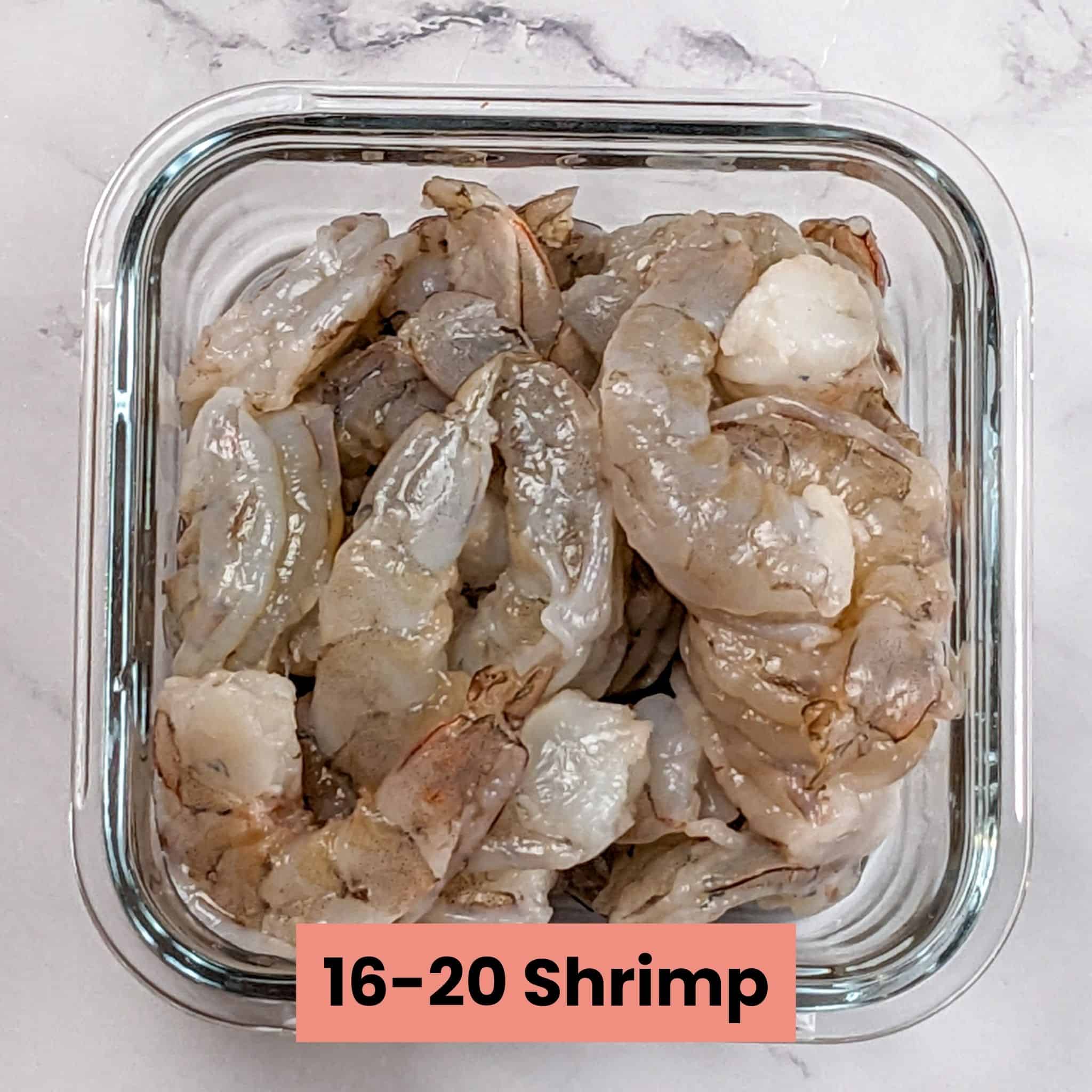 peeled and deveined shrimp in a square glass container.