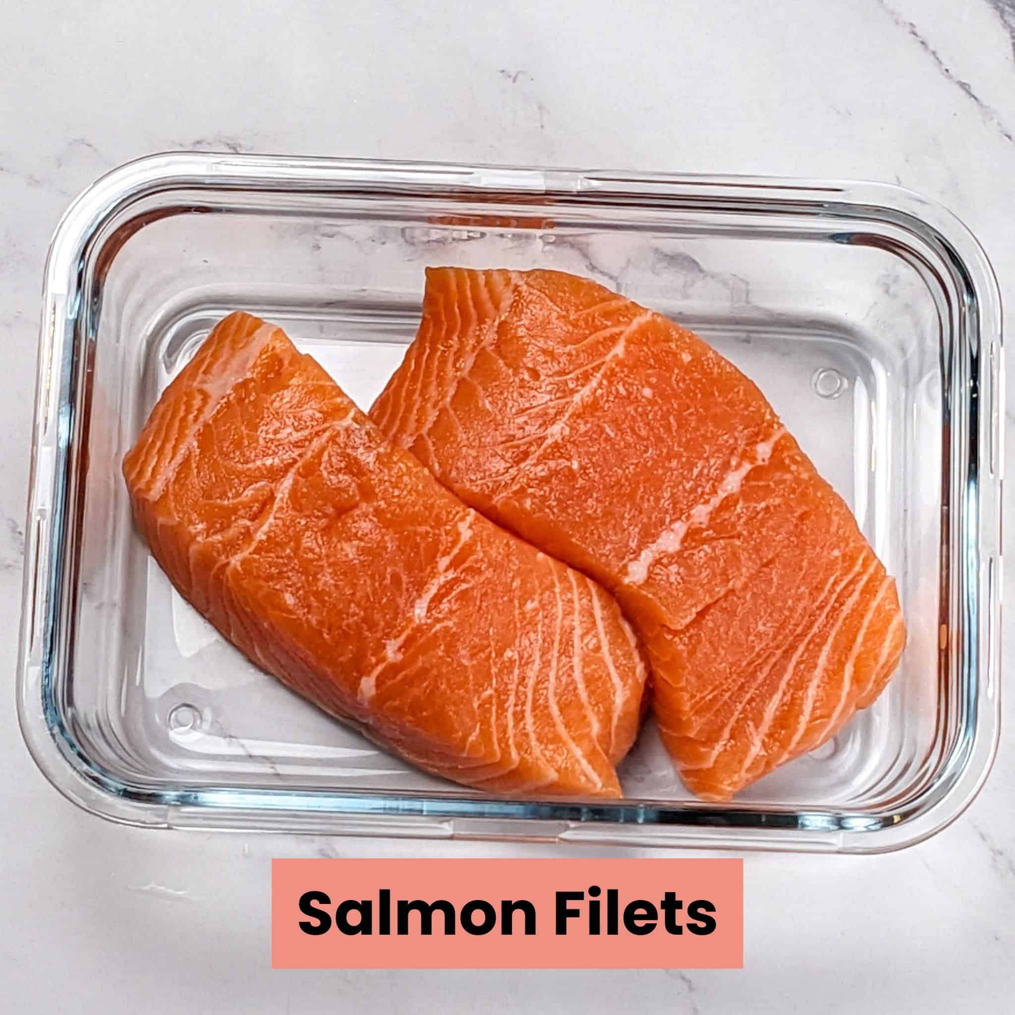 raw salmon filets in a glass rectangle container for the Chili Lime Salmon recipe.