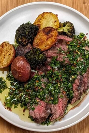 Grilled Steak with Spicy jalapeno Chimichurri sauce with a medley of roasted Baby Potatoes and Broccoli florets.
