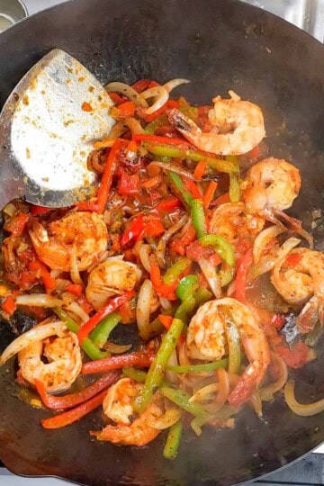 Sauteed vegetable strips were added to the shrimp with the pasta sauce.