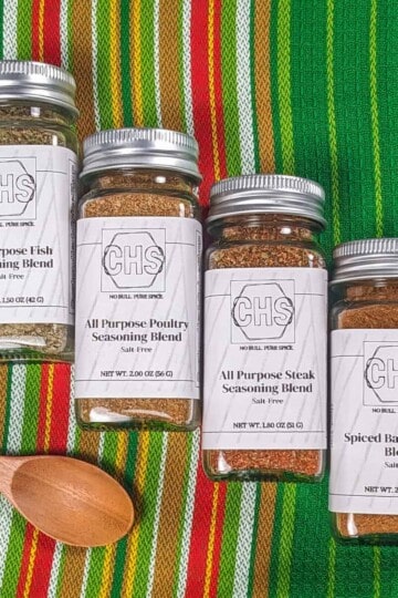 The meal prep bundle from custom herb spice shop, displaying four custom gourmet spice blends: All Purpose Fish Seasoning, All Purpose Poultry Seasoning, All Purpose Steak Seasoning, and Spiced Basmati Rice Blend.