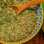 Hot Haitian Seasoning Blend in a colorful bowl.