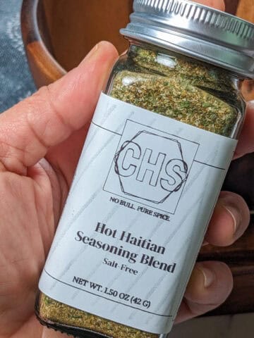 hot haitian spice blend held in hand.