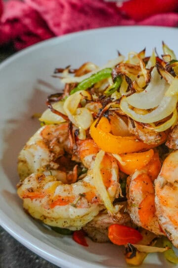 air fried jerk shrimp fajitas in a large wide bowl.