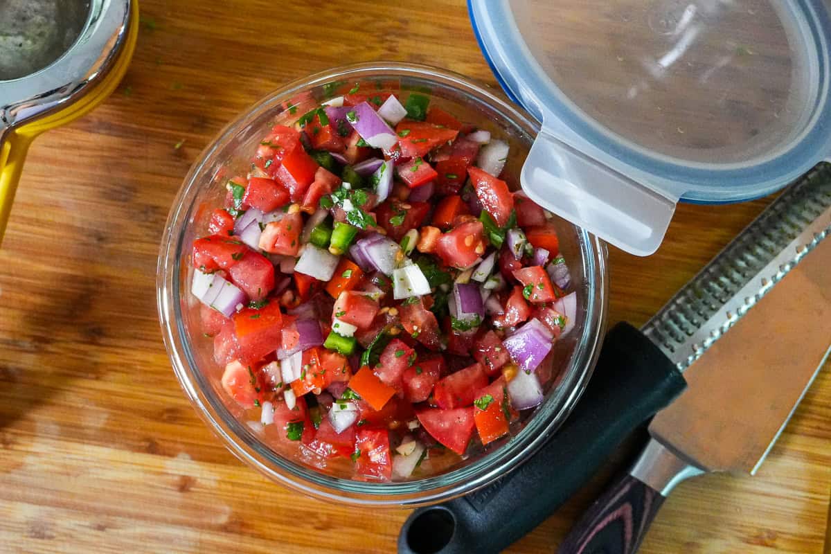 pico de gallo, fresh salsa in a glass container.