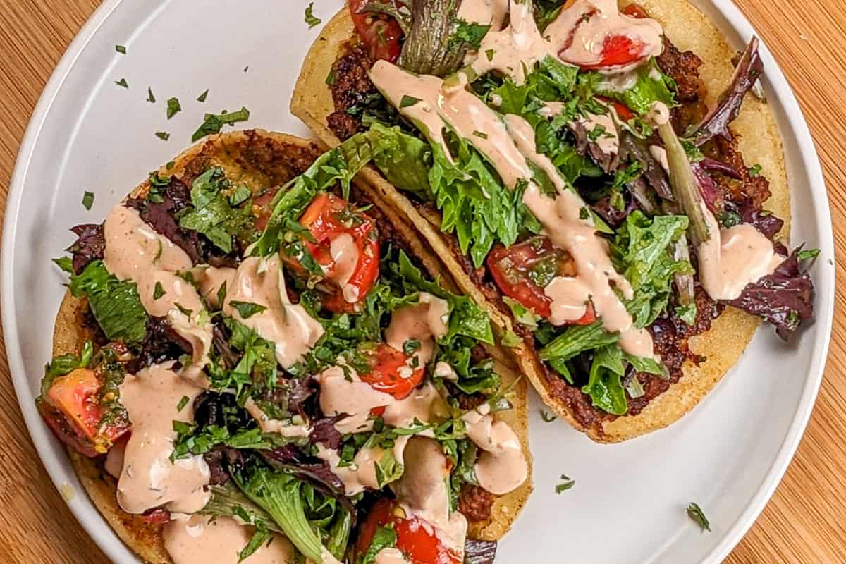 crispy chicken tacos on a plate.