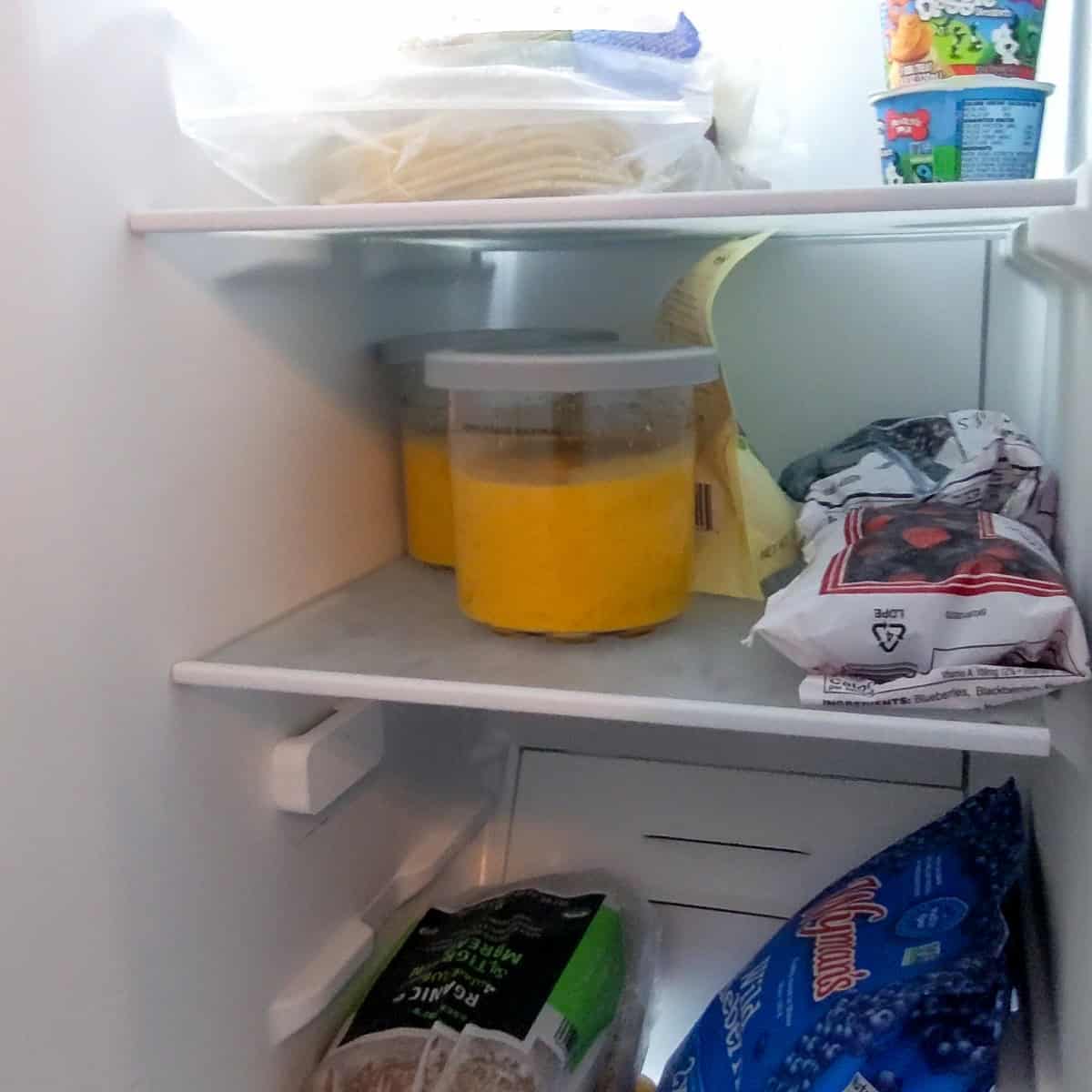 mango coconut felato gelato in a ninja creami pint in the freezer.