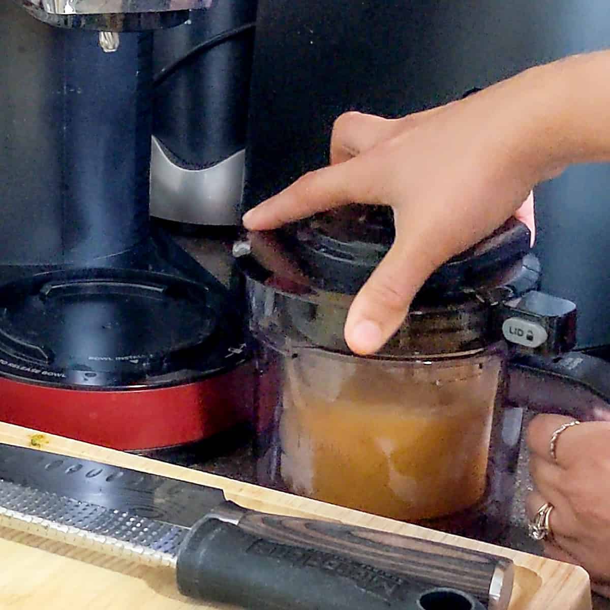 lid being placed on canister before being put into ninja creami.